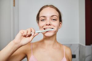 Photo by Marcus Aurelius: https://www.pexels.com/photo/close-up-shot-of-a-woman-brushing-her-teeth-9788574/
