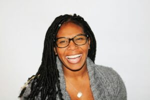 Photo by Tarzine Jackson: https://www.pexels.com/photo/woman-wearing-eyeglasses-773371/ ALT: woman smiling with confidence