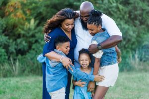 https://pixabay.com/photos/family-african-american-happy-7257182/ Happy family hugging.