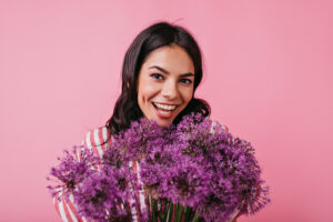 https://www.magnific.com/free-photo/photos-young-girl-with-big-lilac-bouquet-her-hands-posing-portrait_11575919.htm#fromView=keyword&page=2&position=7&uuid=25c86c7e-50a7-464c-b541-541a1030bdb8&query=Smiling+women+with+flowers Woman smiling holding flowers