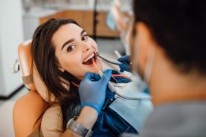 https://pixabay.com/photos/adult-bearded-beautiful-blue-10184708/ Patient smiling in dentist's chair