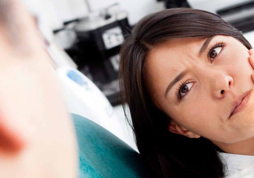 women patient having tooth pain